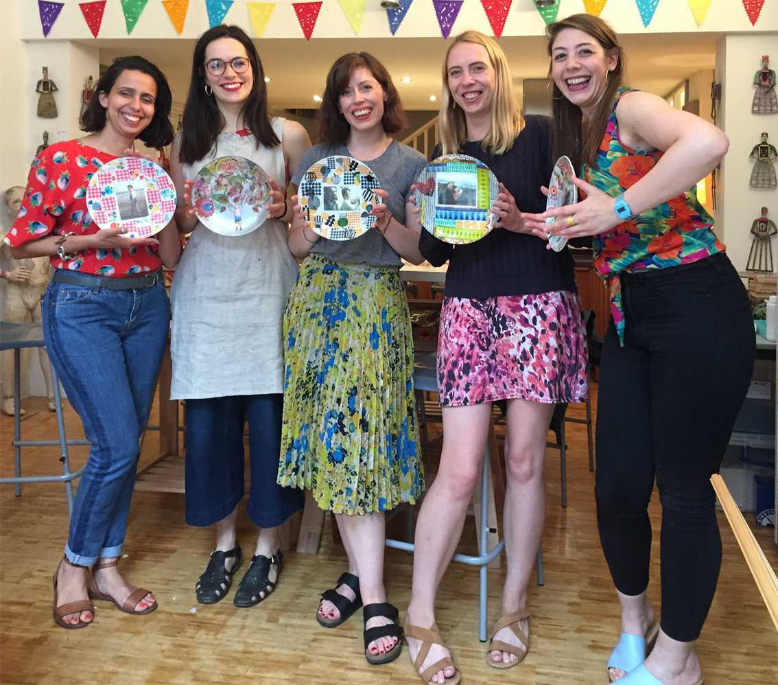 group of friends at the studio, showing their decoupaged plates